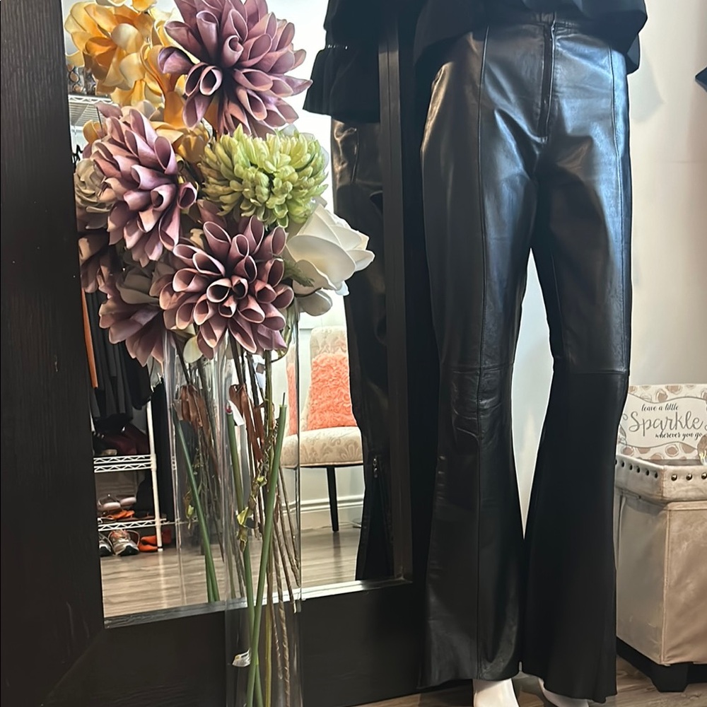 GORGEOUS DANIER Black Leather pants that flare out at the bottom with a zipper. - Picture 10 of 15